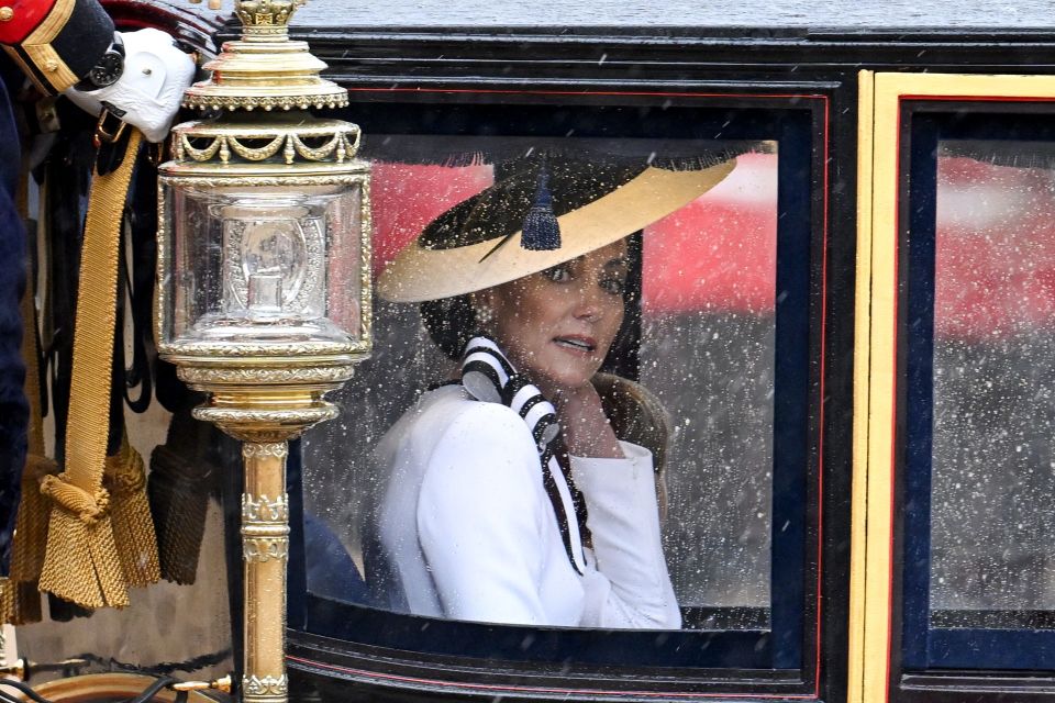 Kate looked show-stopping in a white Jenny Packham dress and matching wide-brim hat