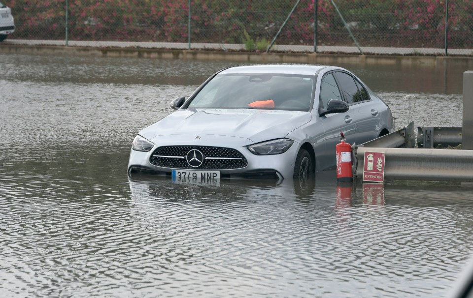 The heavy rainstorm left cars partially underwater