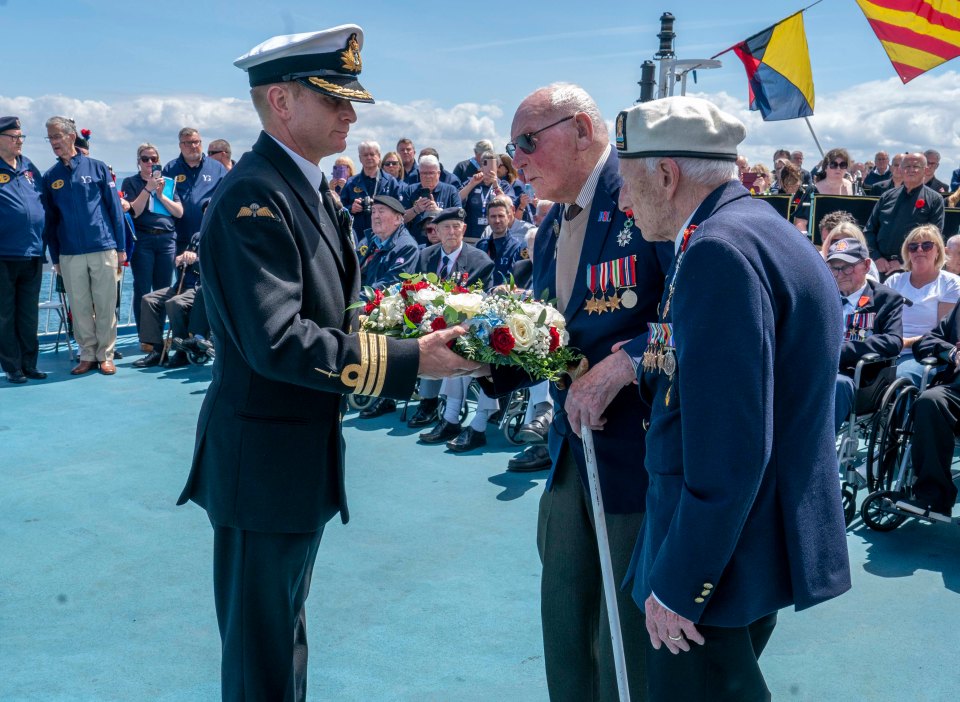 Harry and Alec receive wreath from Cdr Glenn Higson