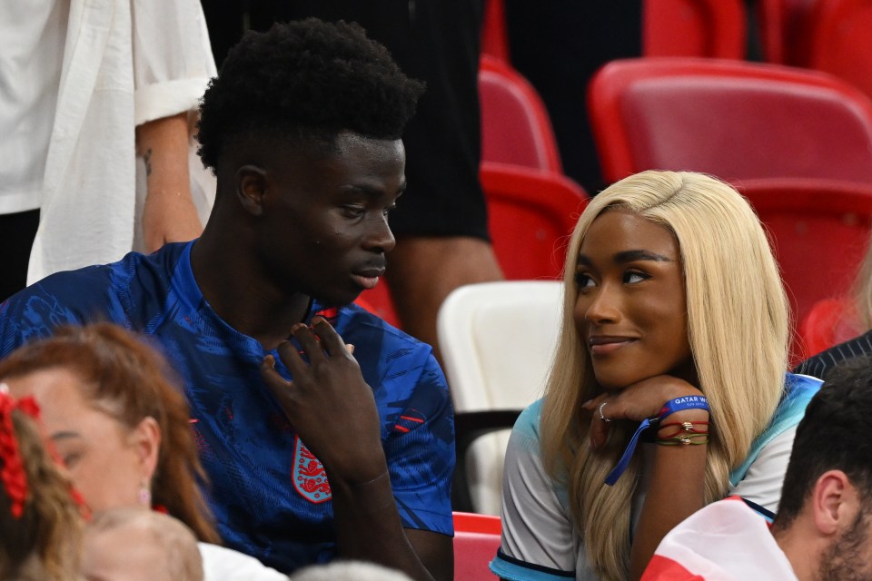 Bukayo Saka pictured with parter Tolami Benson in 2022