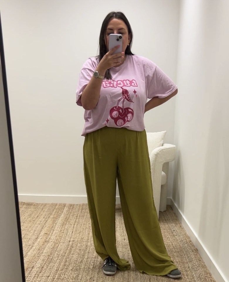 Abby trying on the trousers that were a little too long