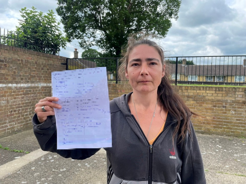 Chelsea Davidson with her petition against the conditions of her housing policy