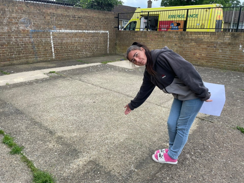 Chelsea Davidson showing the empty space where there was once a pool