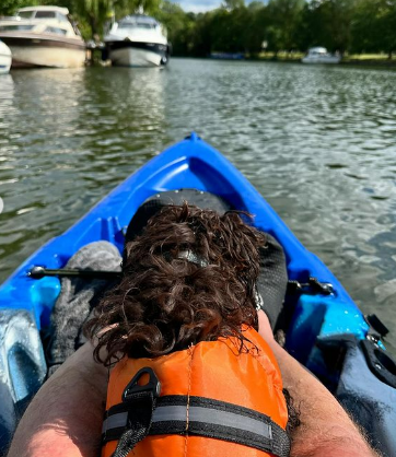 He enjoyed a day on the water with his cockapoo Alfie