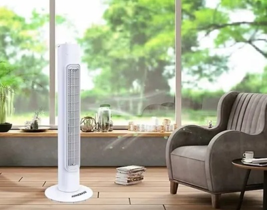 a living room with a tower fan and a chair