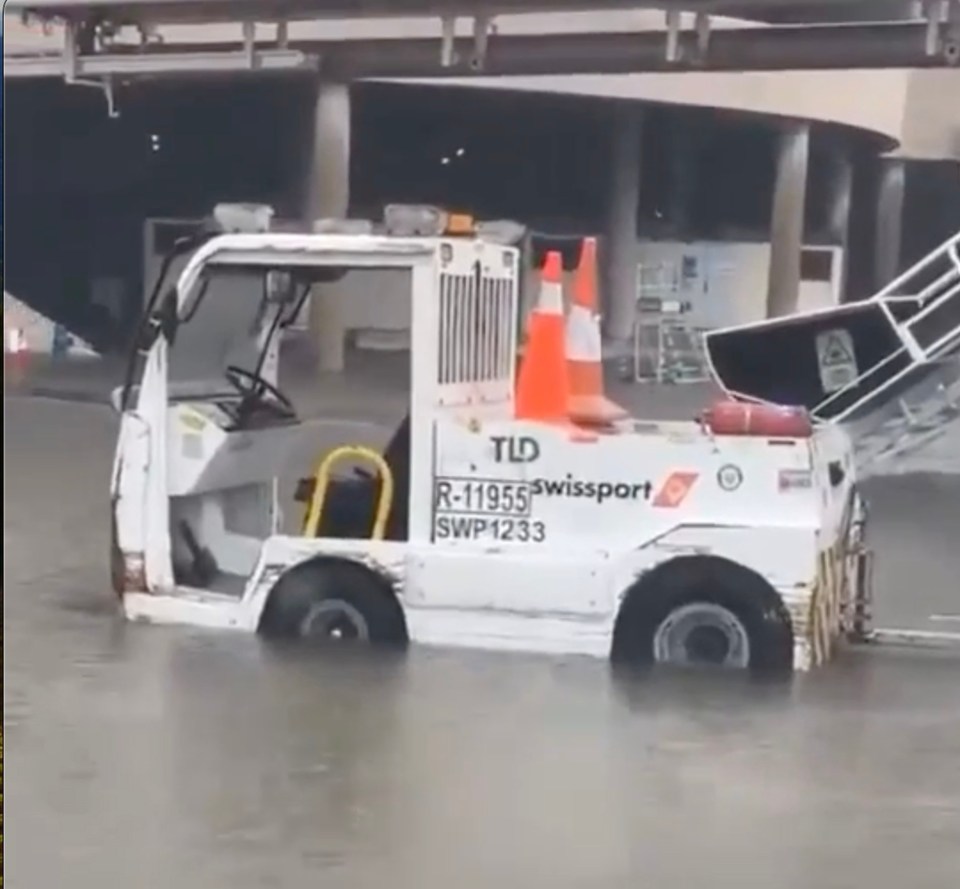 Airport vehicles on the swamped tarmac