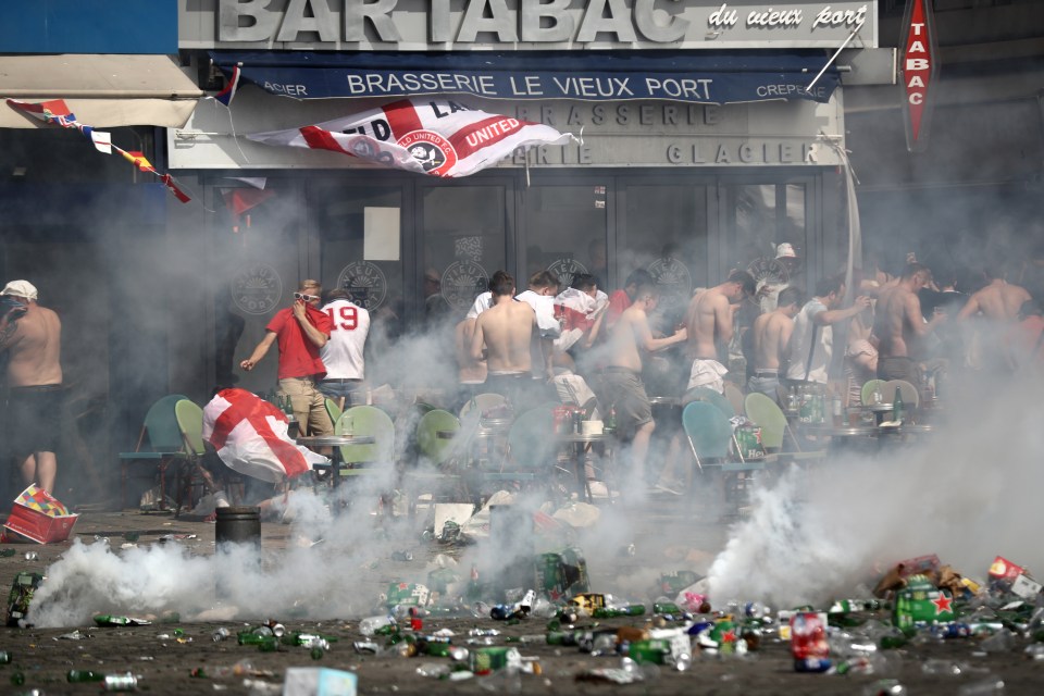 England fans run from tear gas thrown by cops after they were ambushed by Russian supporters at the 2016 Euros