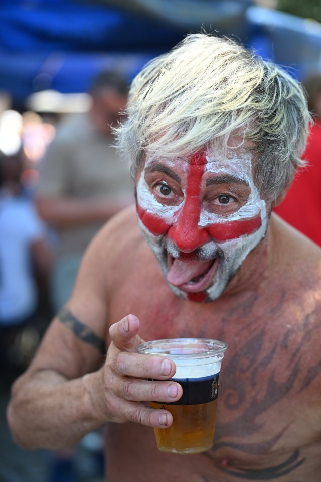 A football fan drinking a beer ahead of tonight's game