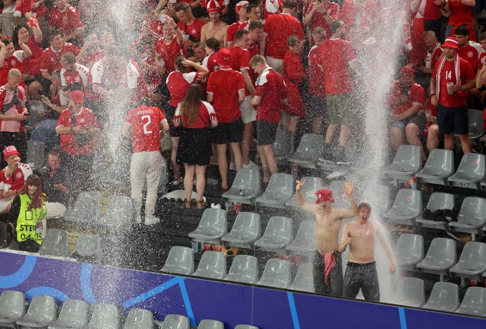 These two fans made the most of the rain in Dortmund