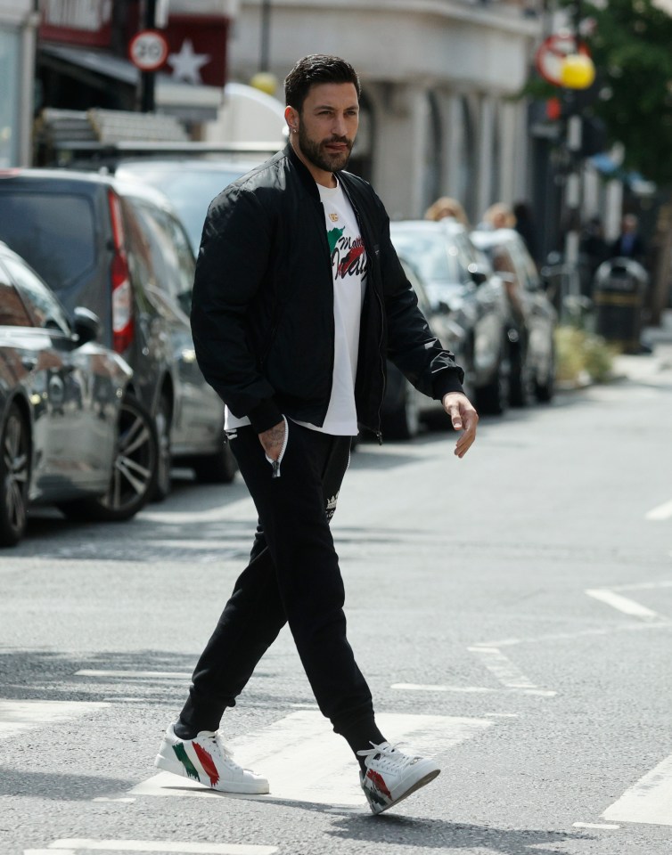 A proud Italian, his shoes and t-shirt both had the country's flag printed across them