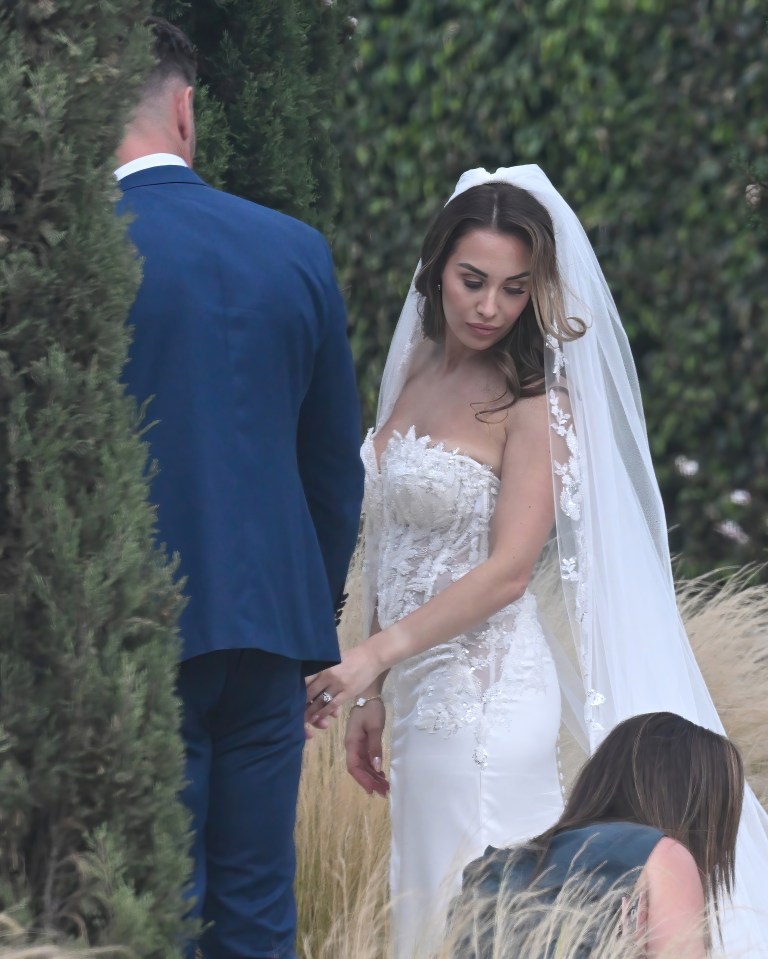 Chloe, 31, opted for a flowing veil which stretched to the floor