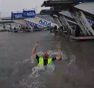 One worker at the airport could be seen diving in the water