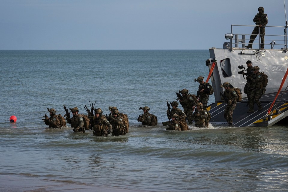 French Naval Forces arrive on OMAHA Beach as they perform an amphibious assault rehearsal with the US Naval Forces as part of D-Day ceremonies