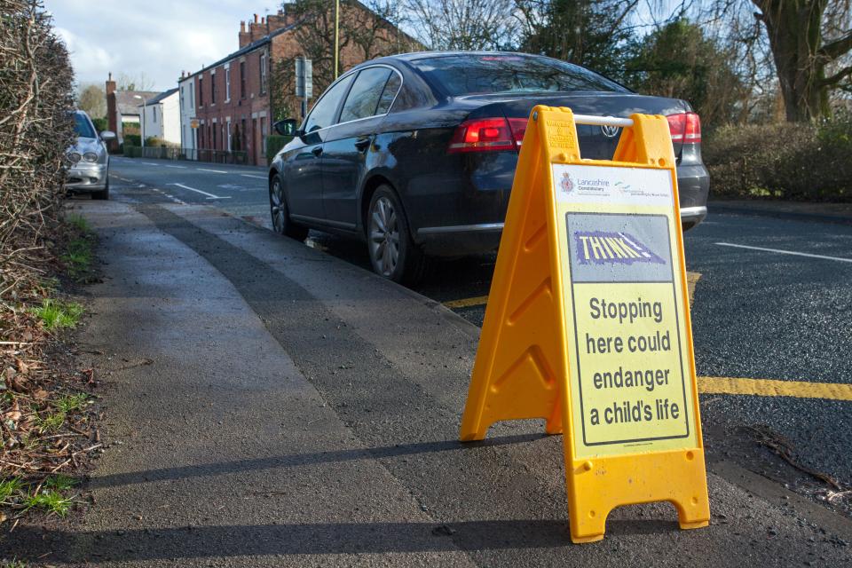 Yellow zig zag lines mean keep clear and no parking outside school entrances