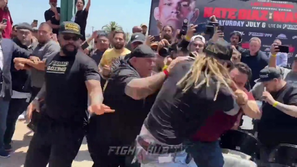 Security tried to break up the fight as they traded blows