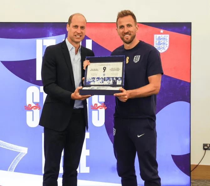 Prince William presenting Harry Kane with a special shirt to be worn in the tournament