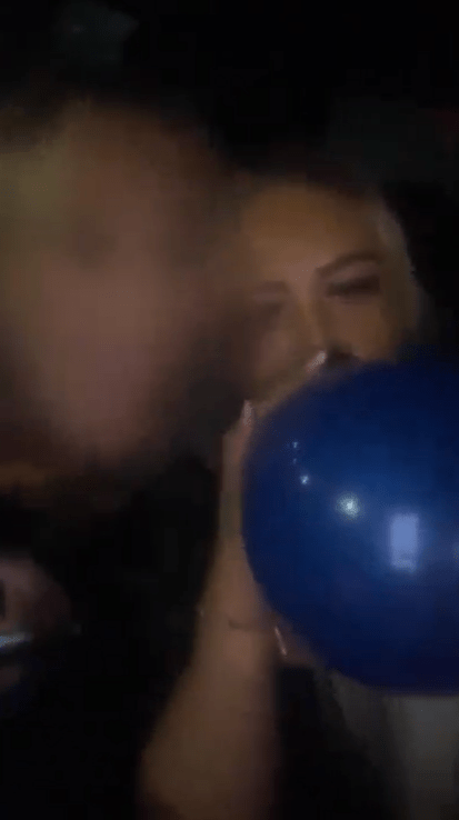 This is the shocking moment a driver filmed herself inhaling laughing gas behind the wheel