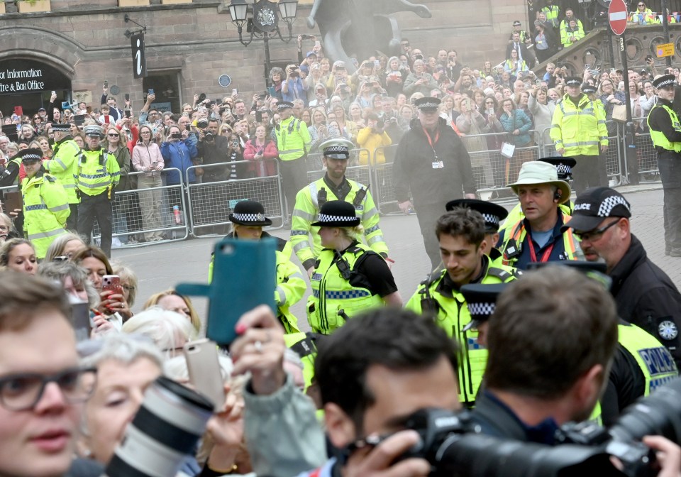 Two activists used fire extinguishers to let off their signature orange smoke