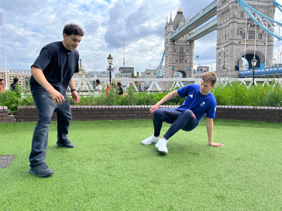 a man in a blue shirt with the word adidas on it