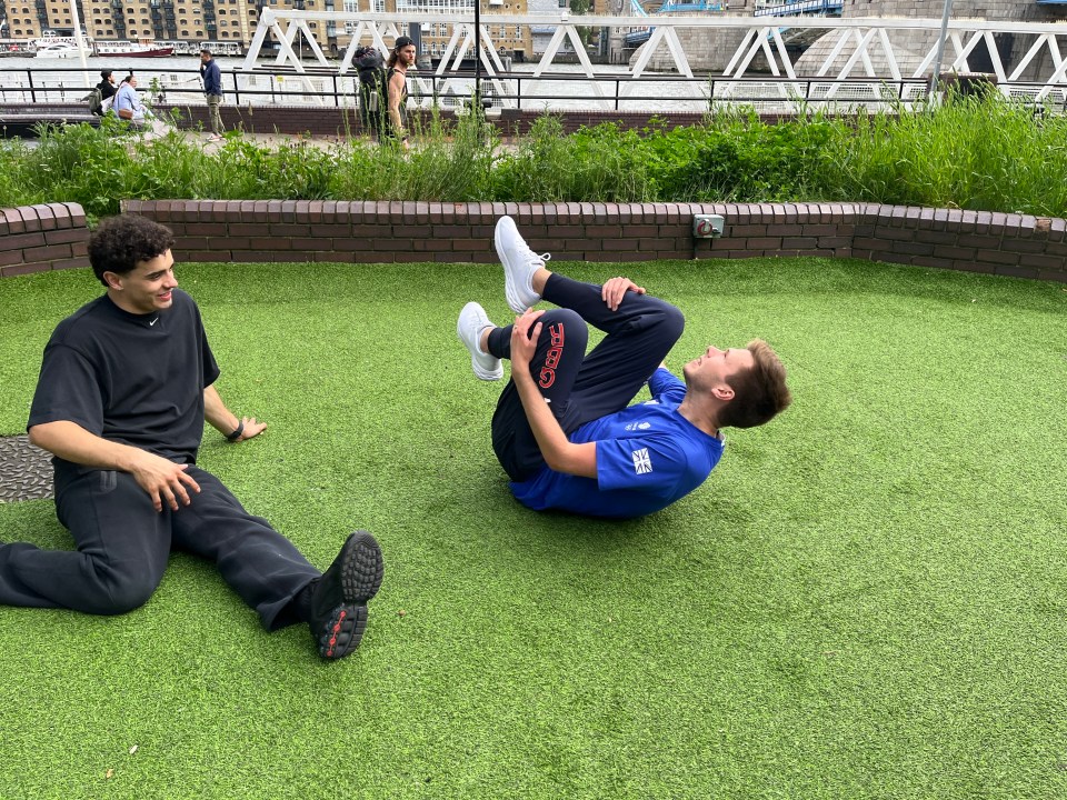 a man in a blue shirt with the word reebok on it