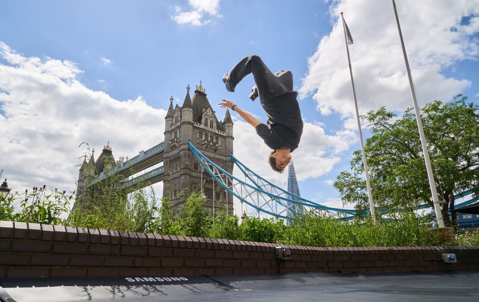 a man is doing a flip on a samsung trampoline