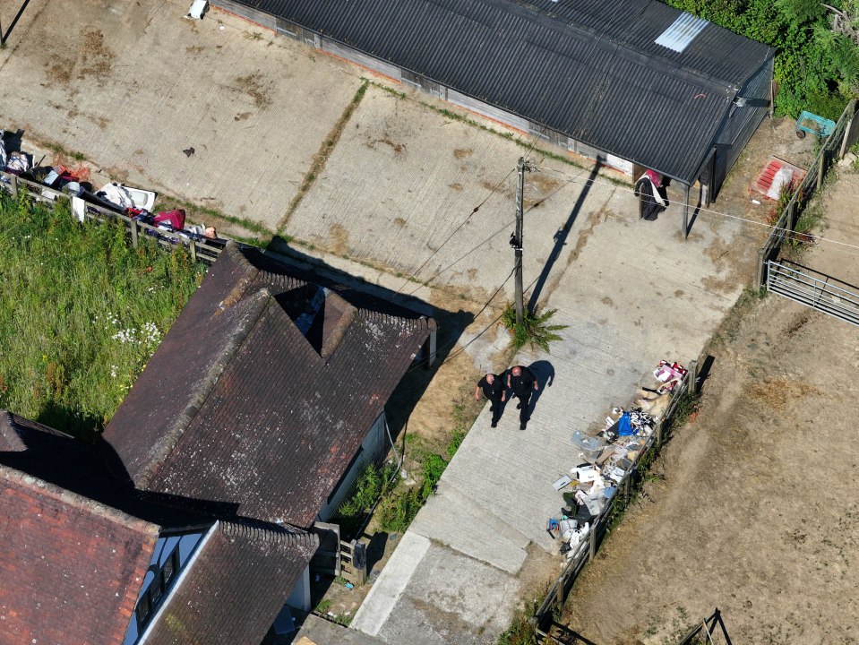 Officials walking around the mansion before keys were handed to a mortgage lender