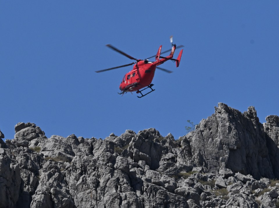 A fire and rescue helicopter joins the search for Dr Mosley