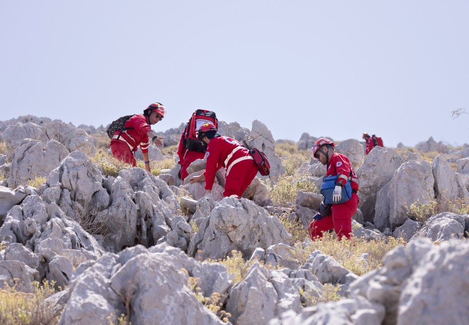 Firefighters combing the mountain side after the search shifted to the rocky outcrops on Saturday