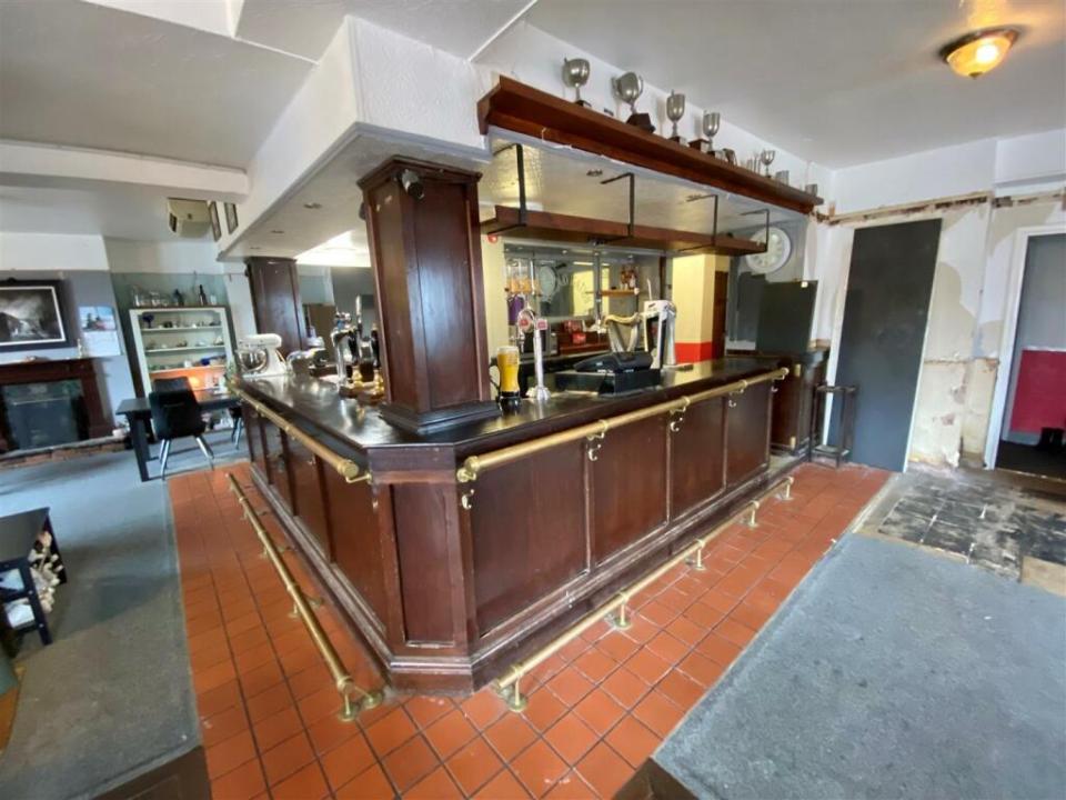 The property features a bar area and a secret pub