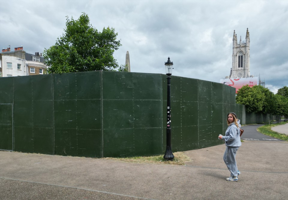 The huge green fence has been blasted as a 'monstrosity'