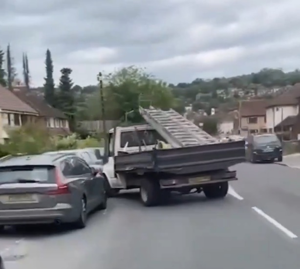 The tipper driver smashing into a parked car