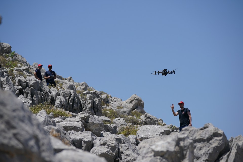 Firefighters, drones, volunteers and helicopters are all involved