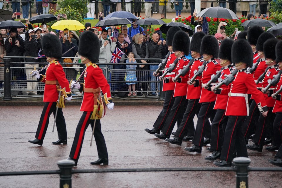 Members of the Irish Guards march along The Mall towards Horse Guards Parade