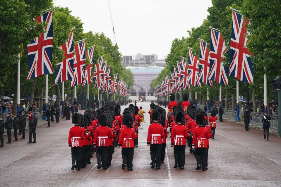 Members of the Irish Guards have started marching along The Mall