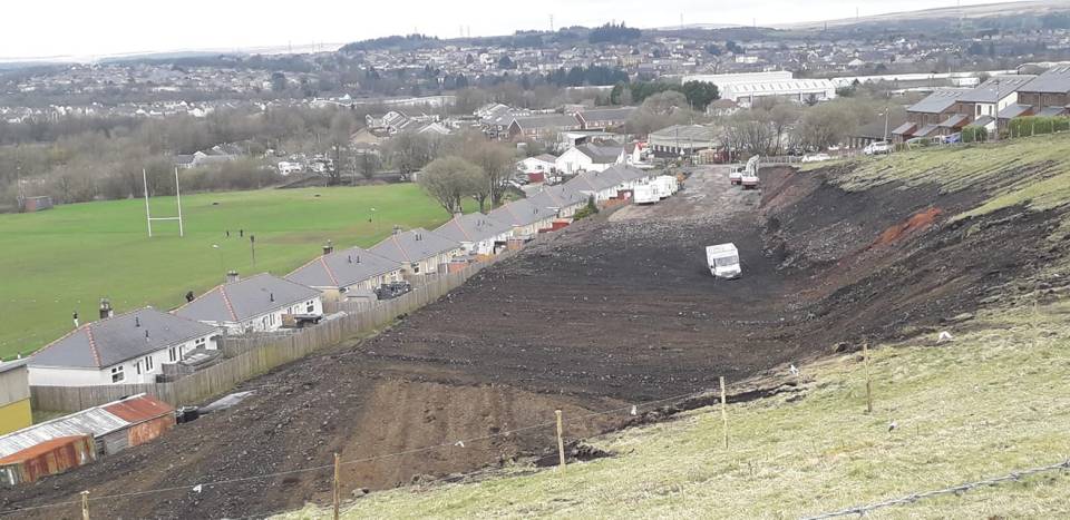 Travellers began excavating a hill near Porters Road, Wales, without planning permission