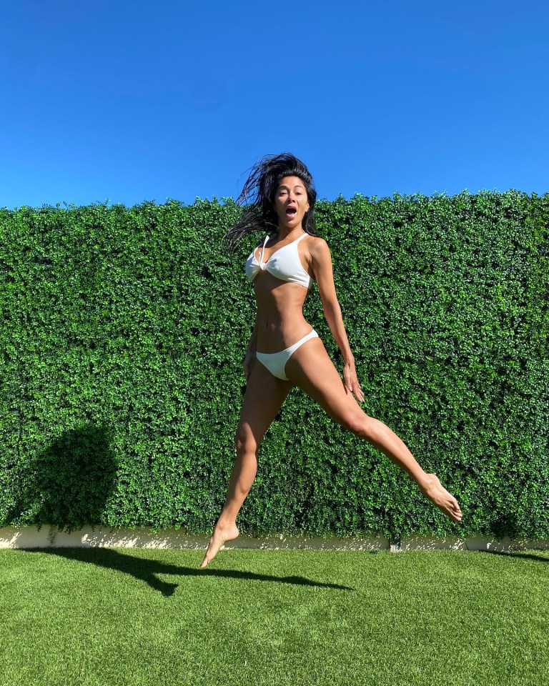 Nicole Scherzinger jumped for joy after the British sunshine finally made an appearance