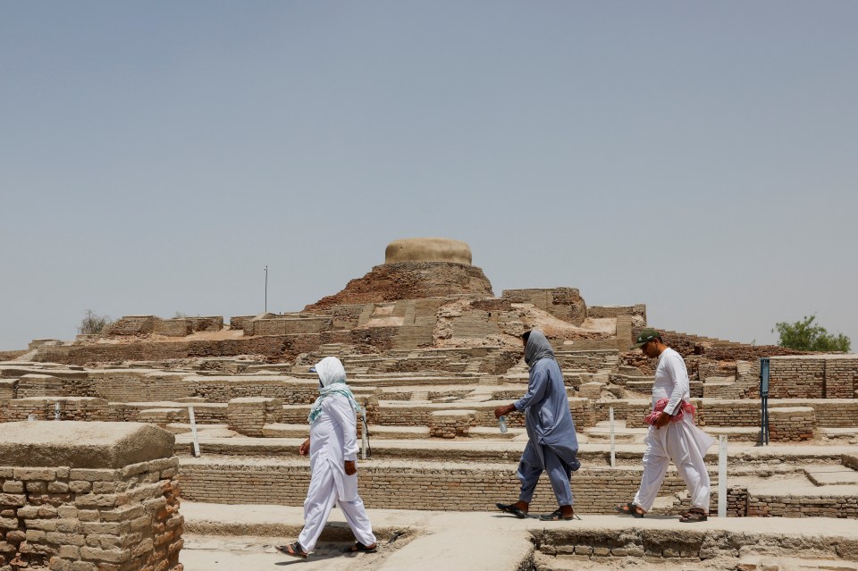 People visit the archaeological sites during a hot summer day in May 2024