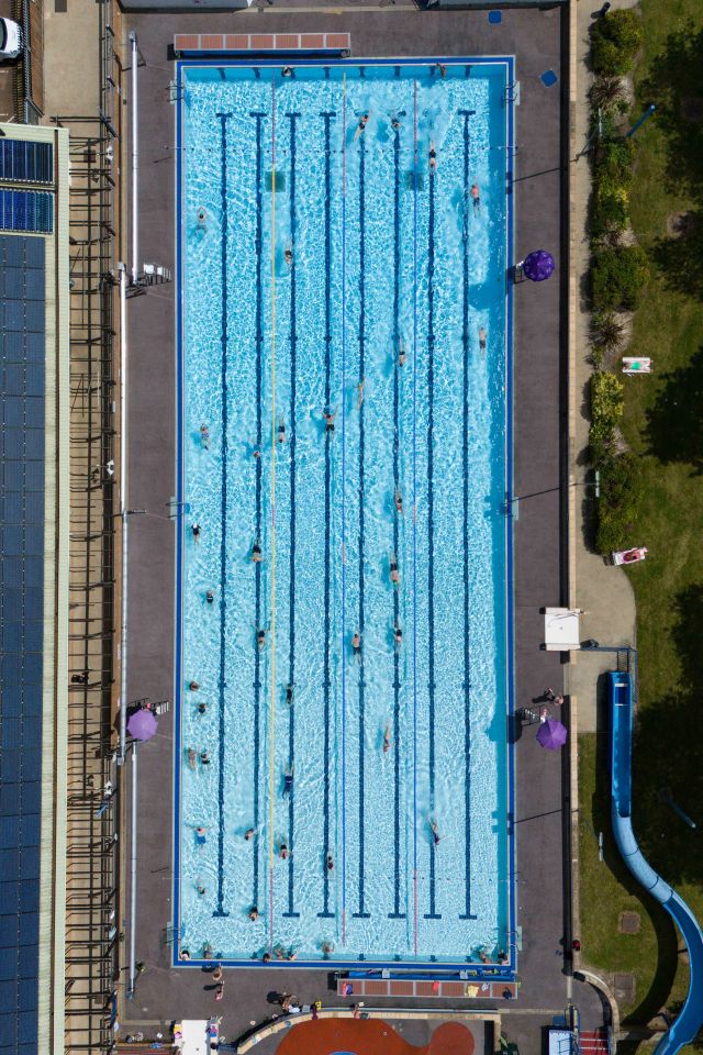 People swim at Banbury Lido at Woodgreen Leisure Centre in Oxfordshire today