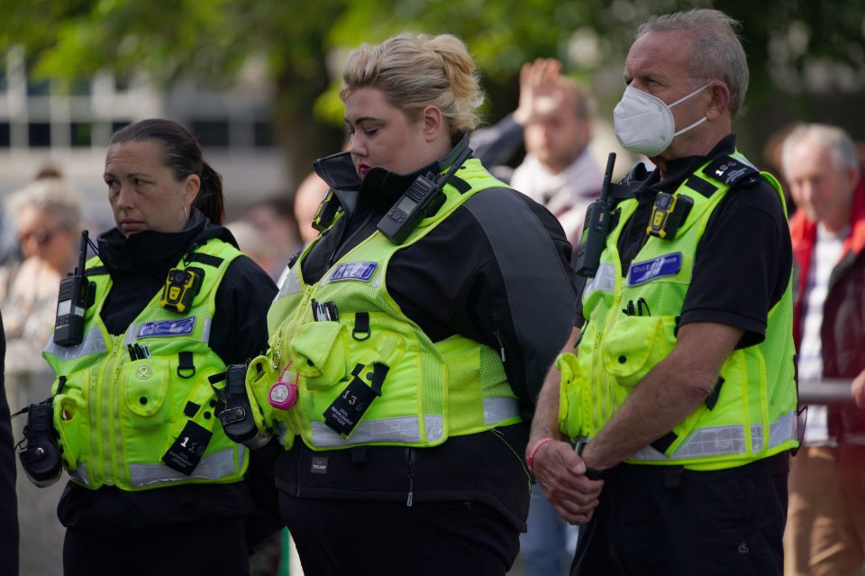 Police join the people of Plymouth in a vigil at the Guildhall, after the murders