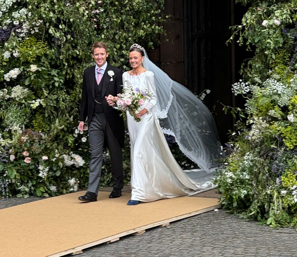 Photos taken on the day showed the newly married couple beaming as they left the chapel