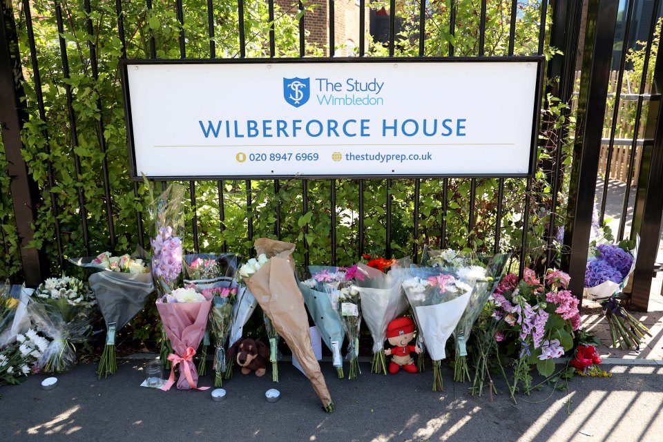 Floral tributes to the two girls were left at the school