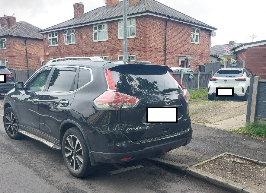 A homeowner was left stunned when a stranger parked over the dropped kerb on their driveway