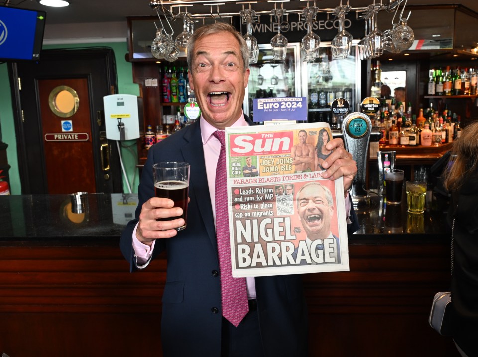 Mr Farage holding today's Sun newspaper after declaring his bid for Parliament