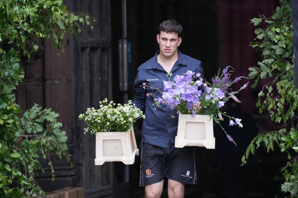 Flowers for the wedding are brought out from a local florist