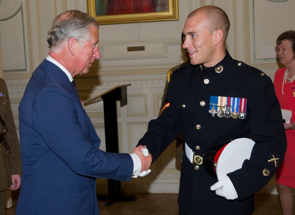 Croucher shaking hands with King Charles