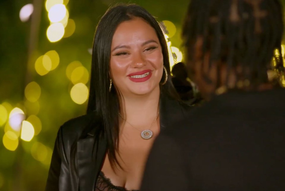 a woman with braces on her teeth smiles at a man