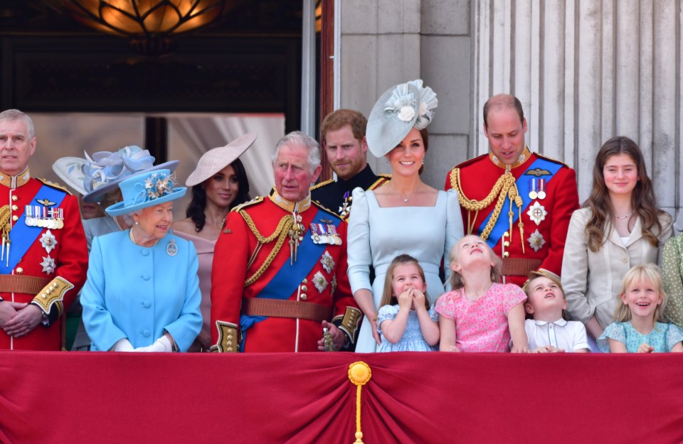 Harry and Meghan on Buckingham Palace balcony in 2018 with the late Queen, the then-Prince Charles, Prince William, Princess Kate, Princess Charlotte, Prince George and Andrew