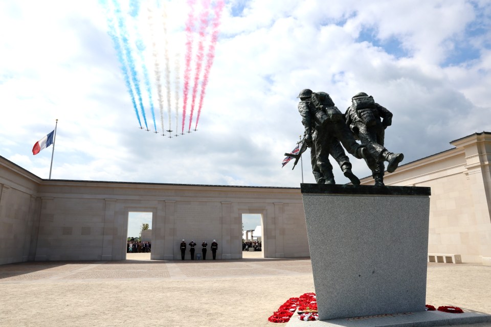 The Red Arrows on a flypast in Ver-Sur-Mer, France