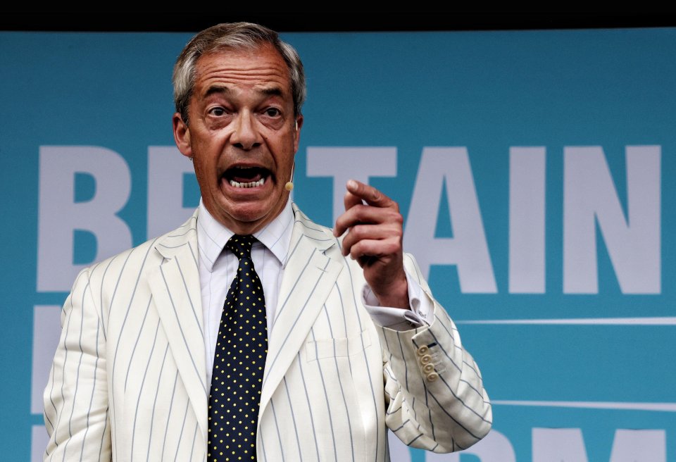 a man in a suit stands in front of a sign that says britain