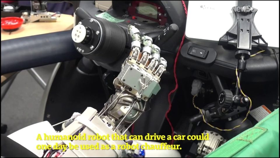 The humanoid can even get the car started